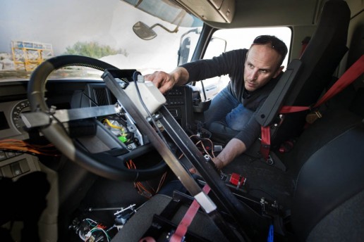 A little girl drives a heavy-duty Volvo truck