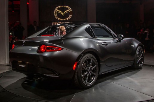 2017-Mazda-MX-5-Miata-RF-on-stage-rear-side-view-lights-on