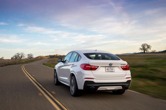 2016-BMW-X4-M40i-rear-three-quarter-in-motion-06