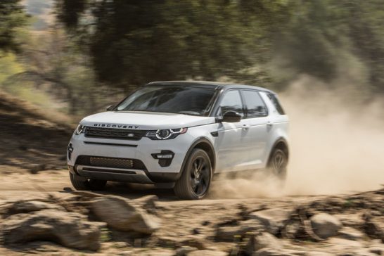 2015-Land-Rover-Discovery-Sport-HSE-front-three-quarters-in-motion-03