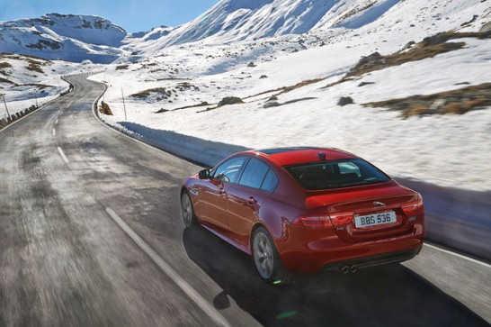 2017-Jaguar-XE-AWD-rear-three-quarter-in-motion