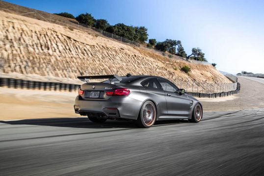 2016-BMW-M4-GTS-rear-three-quarter-in-motion