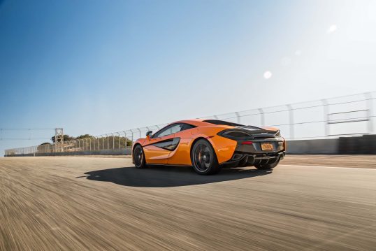 2016-McLaren-570S-rear-three-quarter-in-motion