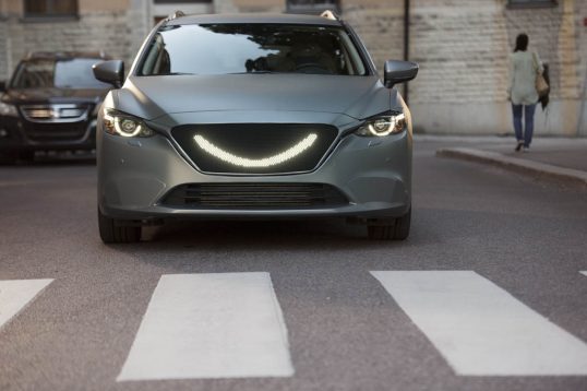 When-the-self-driving-carÔÇÖs-sensors-detect-a-pedestrian-a-smile-lights-up-at-the-front-of-the-car-and-the-car-stops