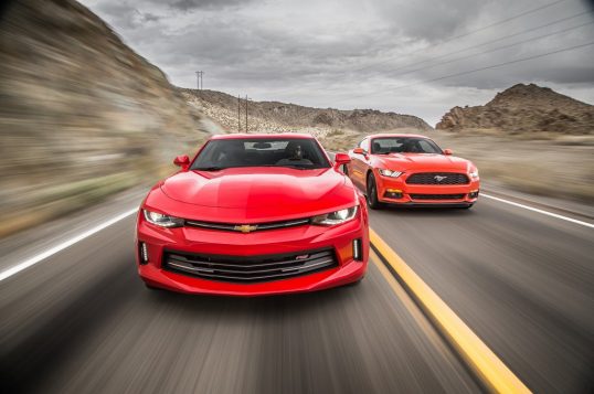 2016-chevrolet-camaro-rs-2016-ford-mustang-ecoboost-front-end-in-motion