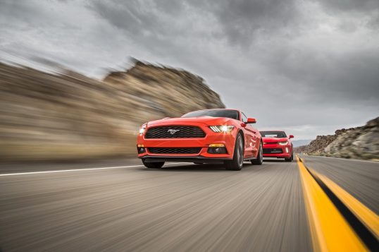 2016-chevrolet-camaro-rs-2016-ford-mustang-ecoboost-front-three-quarter-in-motion