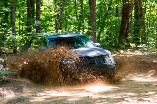 volkswagen-midsize-suv-prototype-front-three-quarter-in-mud-02