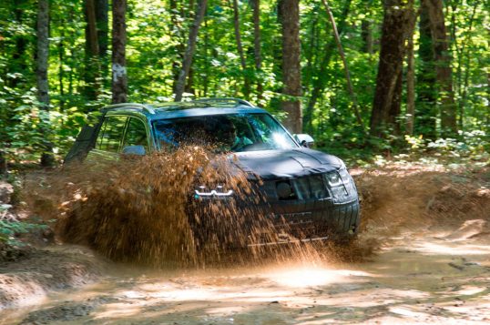 volkswagen-midsize-suv-prototype-front-three-quarter-in-mud-02