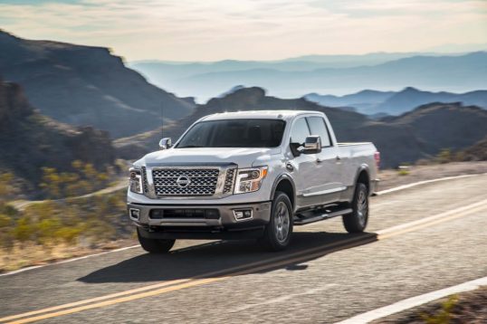 2016-nissan-titan-xd-4x4-platinum-reserve-v8-front-three-quarters-in-motion-03