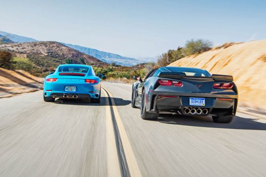 2017-chevrolet-corvette-grand-sport-vs-2017-porsche-911-carrera-s-rear-end-in-motion-02