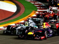 Seb Vettel and Nico Rosberg battle for the lead off the line