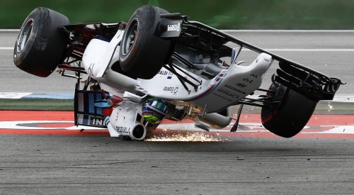 Williams Formula One driver Massa of Brazil crashes with his car in the first corner after the start of the German F1 Grand Prix at the Hockenheim racing circuit