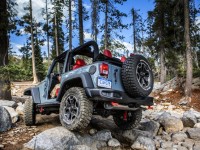 2013-jeep-wrangler-rear-three-quarters-in-motion