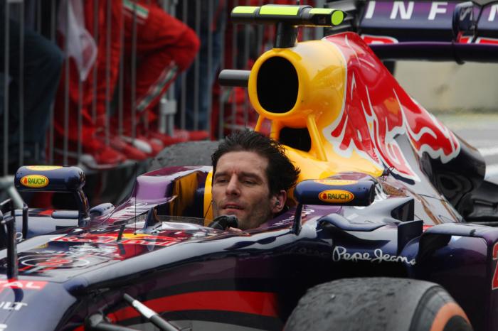 Mark Webber arrives in parc ferme minus his helmet after finishing his last GP